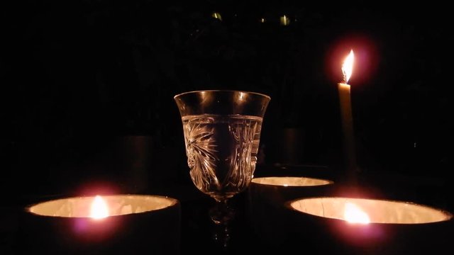 Full Glass Of Wine With Candles And Flames At Night 002