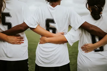 Foto op Plexiglas Female soccer players huddling and standing together © Rawpixel.com