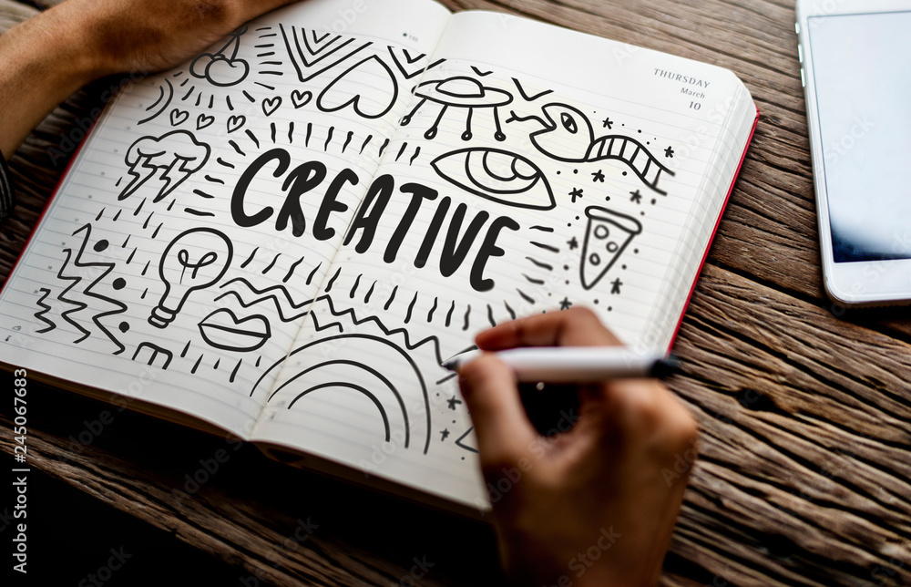 Poster man drawing creative in a notebook