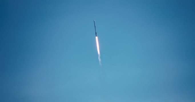 ICBM missile rocket flying into space with exhaust flames and smoke in 4K.