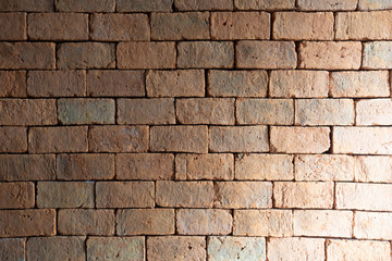 Red bricks arranged in rows near, Wall texture closeup