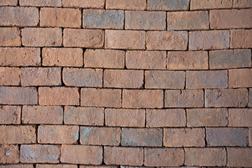 Obraz premium Red bricks arranged in rows near, Wall texture closeup