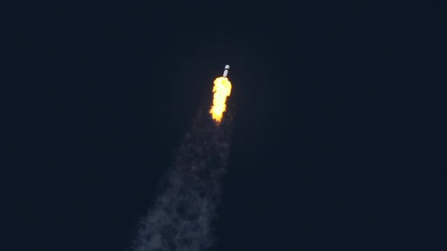 Space rocket or ICBM missile soars into space with bright trail of white smoke and exhaust in a clear blue sky.  120 fps slow motion. With audio.