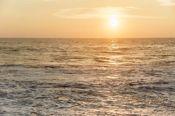 Fototapeta premium Narigama Beach. Stunning sunset on the beach overlooking the ocean and the waves. 