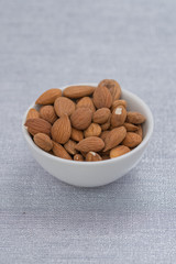 Dried almons in porcelain bowl