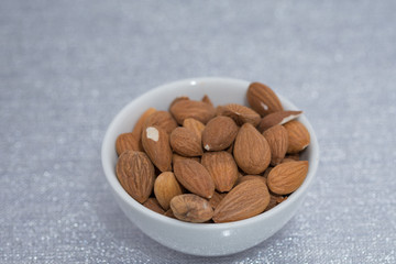 Dried almons in porcelain bowl