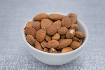 Dried almons in porcelain bowl