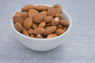 Dried almons in porcelain bowl