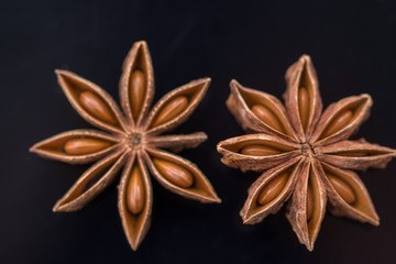  Dried  cinnamon on black acrylic background