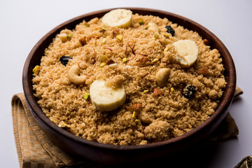 Semolina Halwa / Sooji ka Halva or sweet Rava Sheera or shira - Indian festival sweet made of semolina, nuts and Ghee