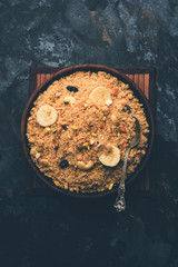 Semolina Halwa / Sooji ka Halva or sweet Rava Sheera or shira - Indian festival sweet made of semolina, nuts and Ghee