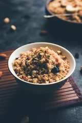 Semolina Halwa / Sooji ka Halva or sweet Rava Sheera or shira - Indian festival sweet made of semolina, nuts and Ghee