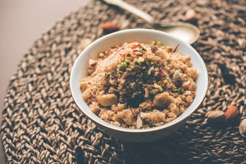 Semolina Halwa / Sooji ka Halva or sweet Rava Sheera or shira - Indian festival sweet made of semolina, nuts and Ghee
