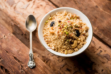 Semolina Halwa / Sooji ka Halva or sweet Rava Sheera or shira - Indian festival sweet made of semolina, nuts and Ghee