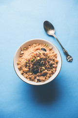 Semolina Halwa / Sooji ka Halva or sweet Rava Sheera or shira - Indian festival sweet made of semolina, nuts and Ghee