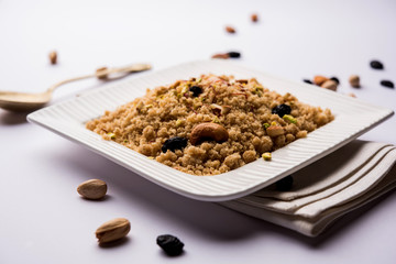 Semolina Halwa / Sooji ka Halva or sweet Rava Sheera or shira - Indian festival sweet made of semolina, nuts and Ghee
