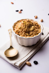 Semolina Halwa / Sooji ka Halva or sweet Rava Sheera or shira - Indian festival sweet made of semolina, nuts and Ghee