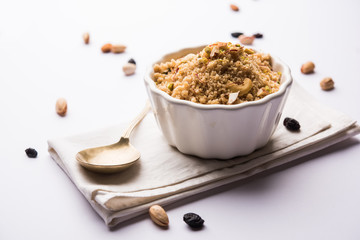 Semolina Halwa / Sooji ka Halva or sweet Rava Sheera or shira - Indian festival sweet made of semolina, nuts and Ghee