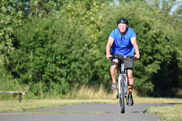 Serious Male Cyclist Riding Bike