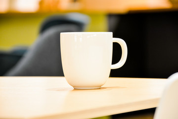 Coffee cup in a table