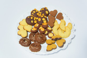 Shortbread dough cookies on a white background. Round shaped cookies with icing sugar. Sweet...