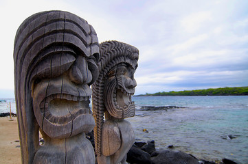 Famous wooden Tiki sculptures at Pu'uhonua O Honaunua National Park