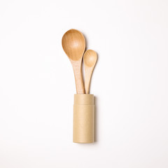 Wooden spoons in holder on white background