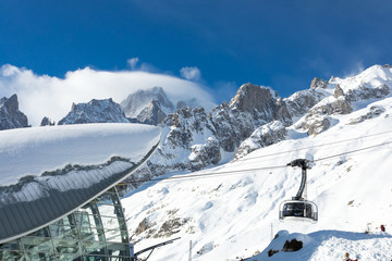 Mont Blanc landscape with snow and cable car panoramic viewpoint -  Courmayeur, Aosta Valley, Italy. The Alps eighth wonder of the world. - obrazy, fototapety, plakaty