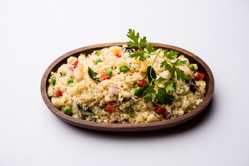 Rava Upma / Uppuma - south indian breakfast served in a bowl. selective focus