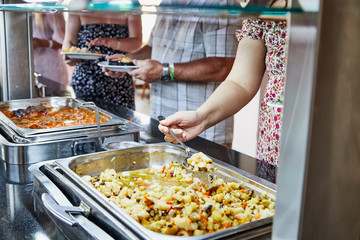 Food on the shelves in the self service buffet with all inclusive in the hotel