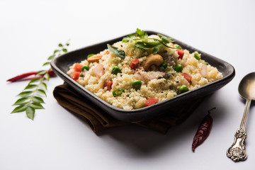 Rava Upma / Uppuma - south indian breakfast served in a bowl. selective focus