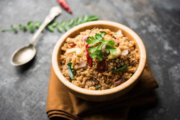 Rava Upma / Uppuma - south indian breakfast served in a bowl. selective focus