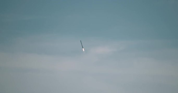 First-stage booster descends back to landing zone at Cape Canaveral after launching a space capsule to the International Space Station. 4K at 120 fps slow motion.