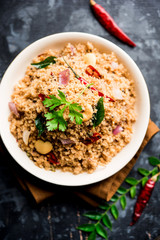 Rava Upma / Uppuma - south indian breakfast served in a bowl. selective focus