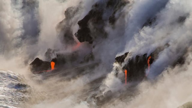 Cinemagraph of volcano erupting by ocean