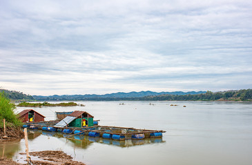 Fototapeta na wymiar The raft floating fish farming and sky on the Mekong River at Loei in Thailand.