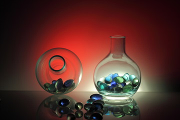 Glass bottles filled with glass balls
