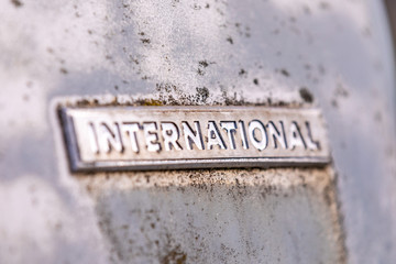 Old worn chrome plate with engraving 