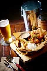 Fried potato, fried chicken with glass of beer 