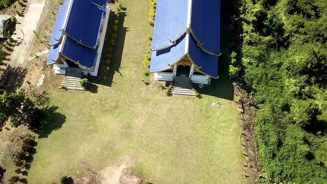 Raising up over the Pusang Blue roof Pai Hao Temple Northern Thailand