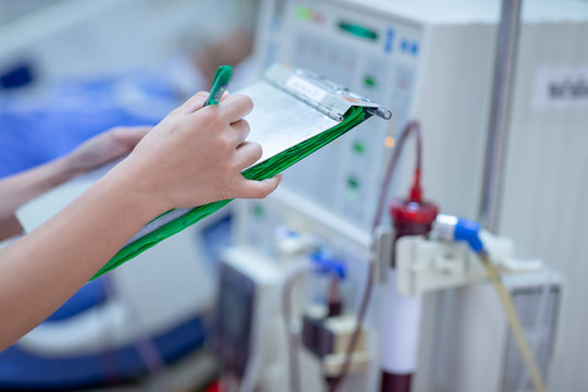 Dialysis nurse are checking dialysis machine before hemodialysis replacement kidney dysfunction or renal failure in intensive care unit.