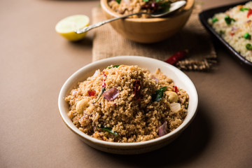 Rava Upma / Uppuma - south indian breakfast served in a bowl. selective focus