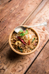 Rava Upma / Uppuma - south indian breakfast served in a bowl. selective focus