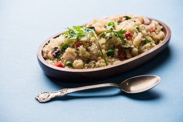 Rava Upma / Uppuma - south indian breakfast served in a bowl. selective focus