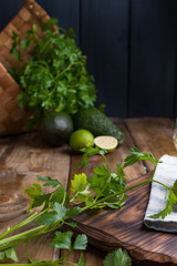 Fresh parsley on a wooden board. Free space for text.