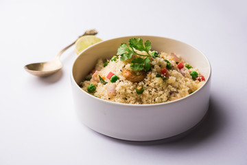 Rava Upma / Uppuma - south indian breakfast served in a bowl. selective focus