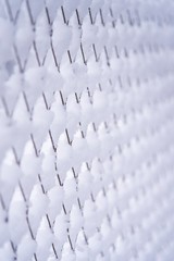 wire mesh grid covered by snow