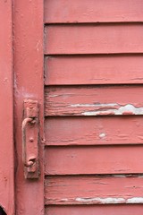 Peeling paint on wooden board close up