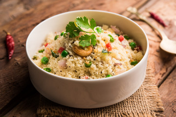 Rava Upma / Uppuma - south indian breakfast served in a bowl. selective focus
