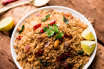 Rava Upma / Uppuma - south indian breakfast served in a bowl. selective focus